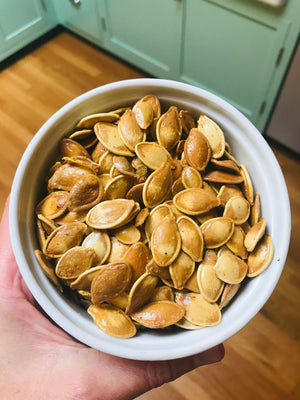 A close up roasted pumpkin seeds.