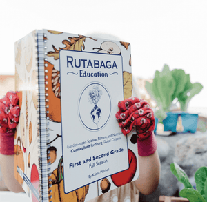 The first and second grade Rutabaga book being ready by a child with garden gloves.