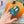 A woman's handing showing that an adult would use two fingers in the Pumpkin Scraper.